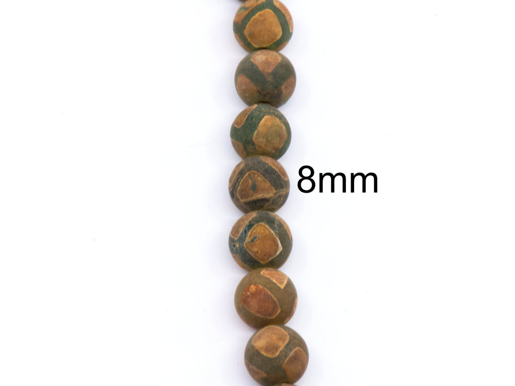 A vertical strand of round frosted Tibetan agate  beads in earthy brown and green, with an '8mm' size overlay on a plain white background.