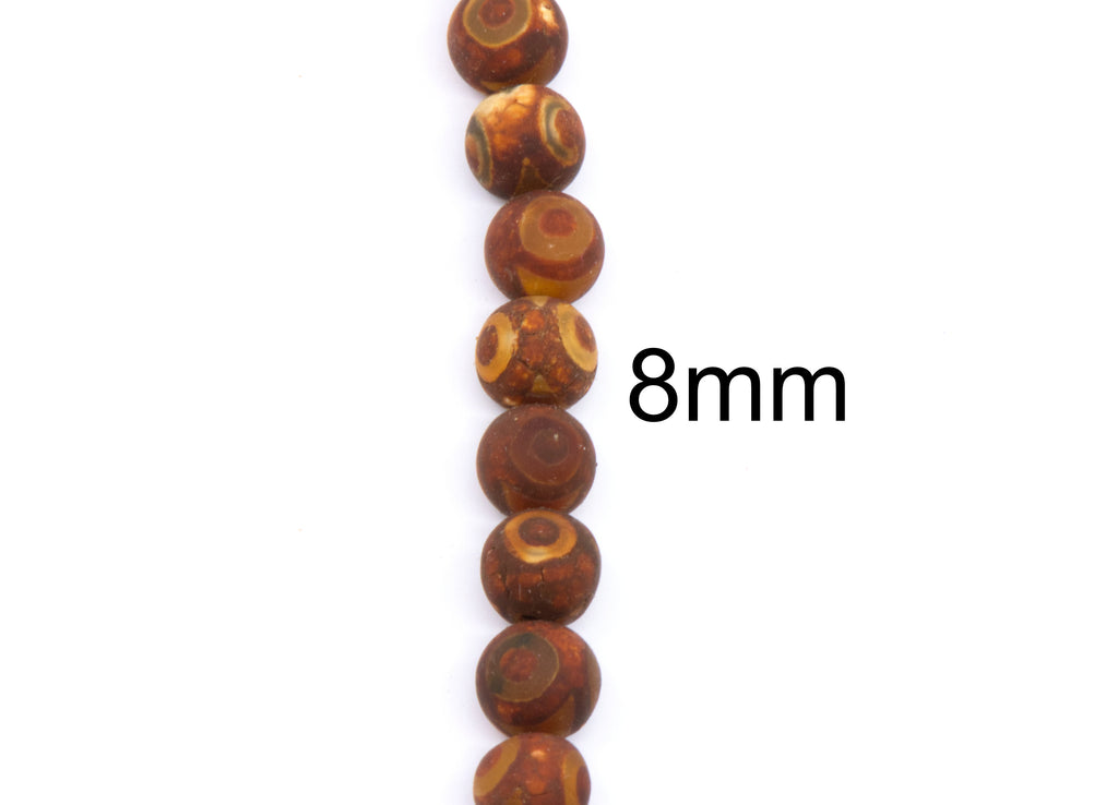 A vertical strand of round brown-red beads with circle patterns, shown on a white background with the text '8mm' indicating the bead size.