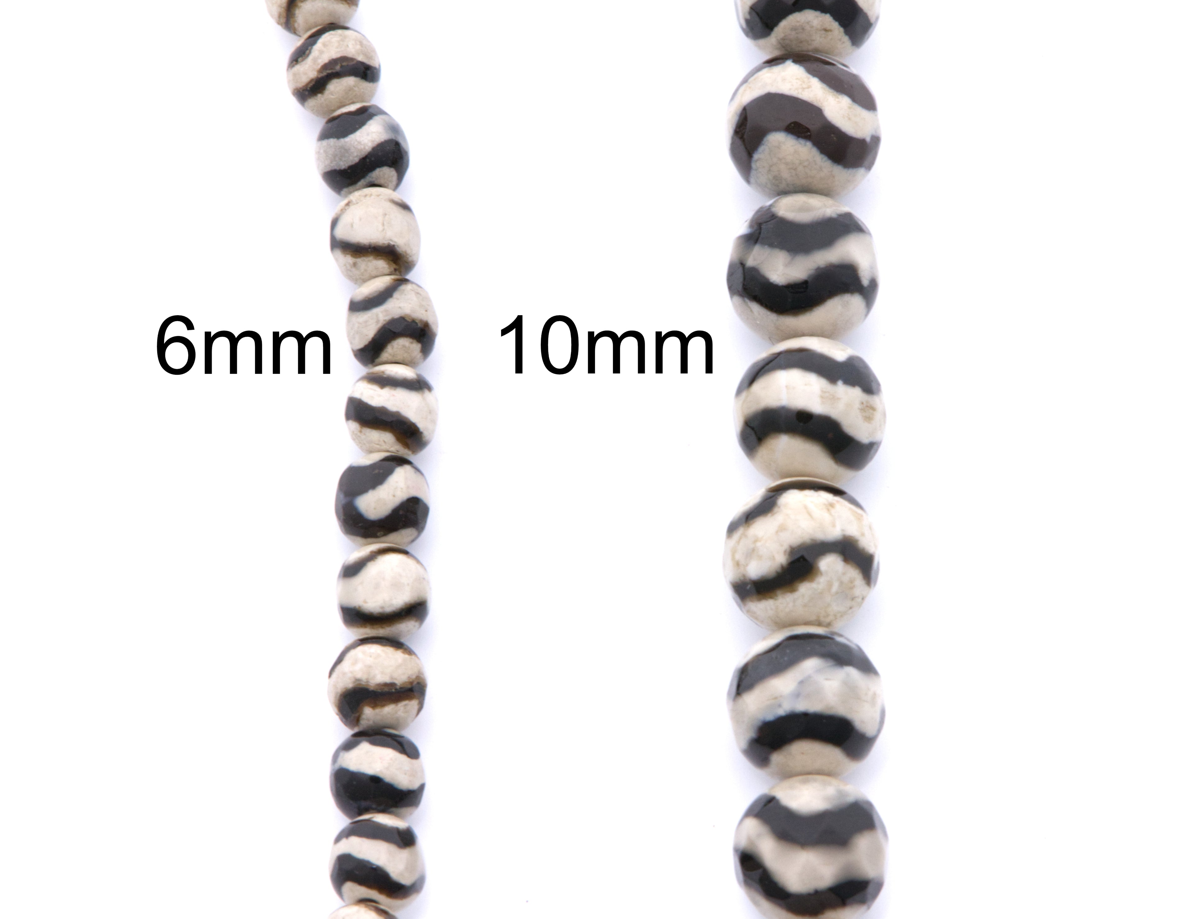 Two strands of round beads with a black and off-white zebra-stripe pattern, labeled 6mm and 10mm, on a plain white background.