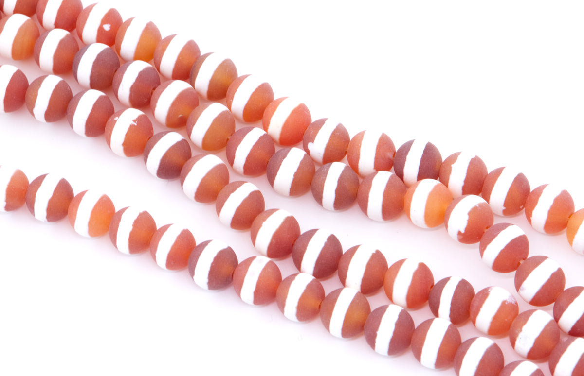 round orange Tibetan agate with white stripes, arranged in diagonal strands on a white background.