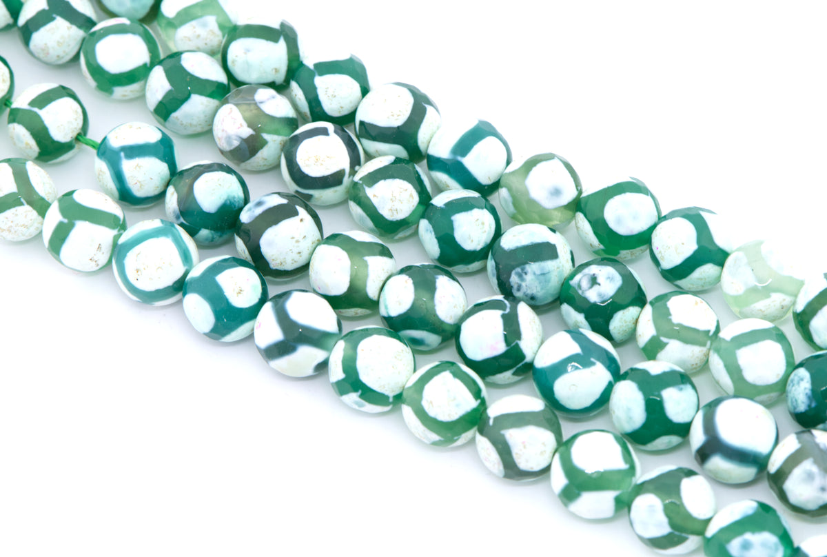 Green and white round Tibetan agate beads arranged diagonally on a clean white background.