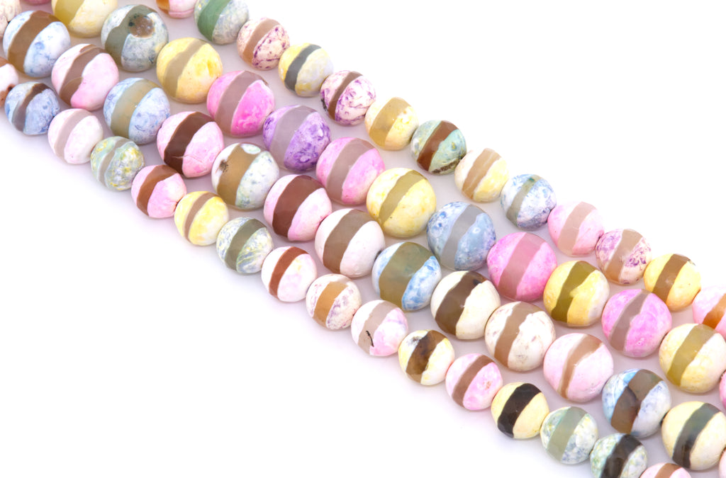 Four strands of round stripe Tibetan agate  beads in pastel colors, including pink, yellow, blue, brown, and white, arranged diagonally on a white background.