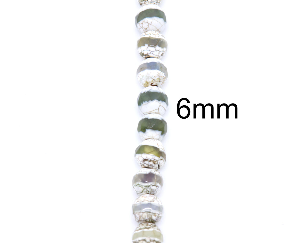 A close-up vertical shot of a string of round Tibetan agate beads on a white background, with the text '6mm' printed to the right to indicate the bead size.