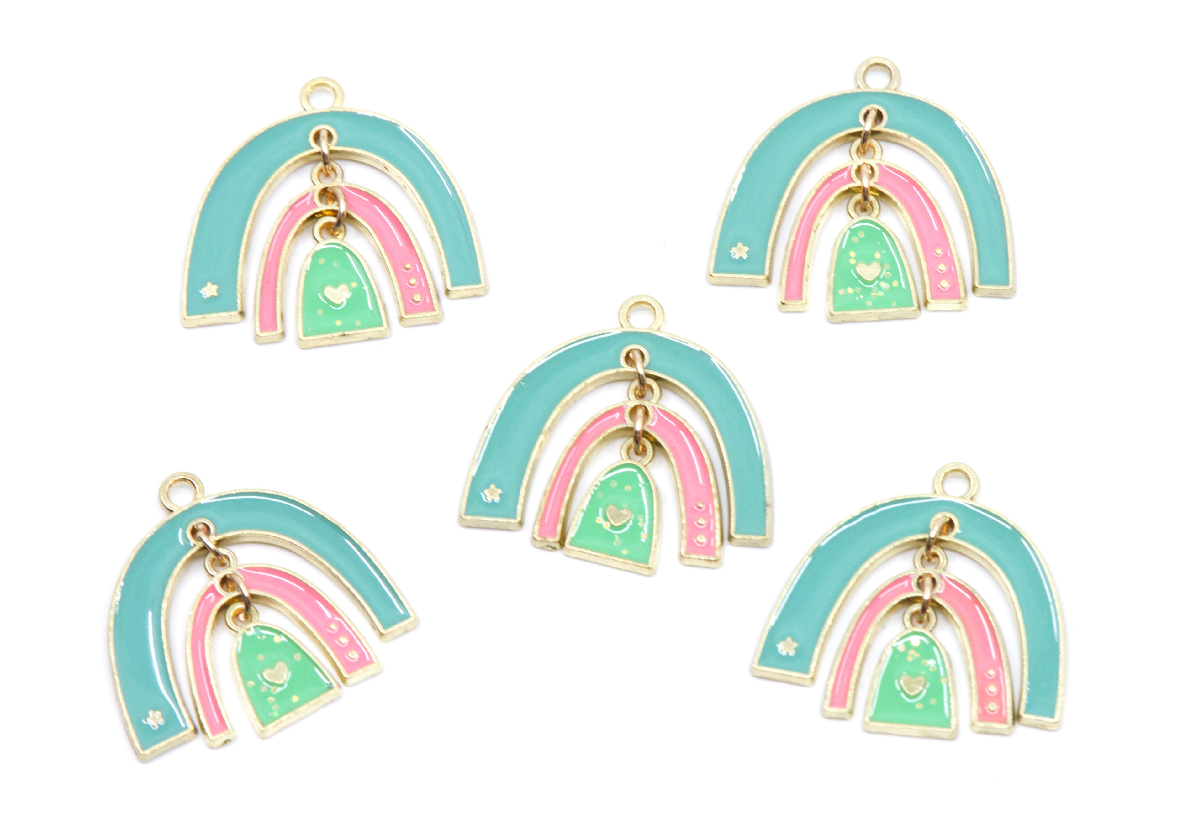 Five matching enamel rainbow charms with gold-tone metal outlines, featuring light blue outer arches, pink inner arches, mint green center arches, and small hanging heart charms, arranged on a plain white background.