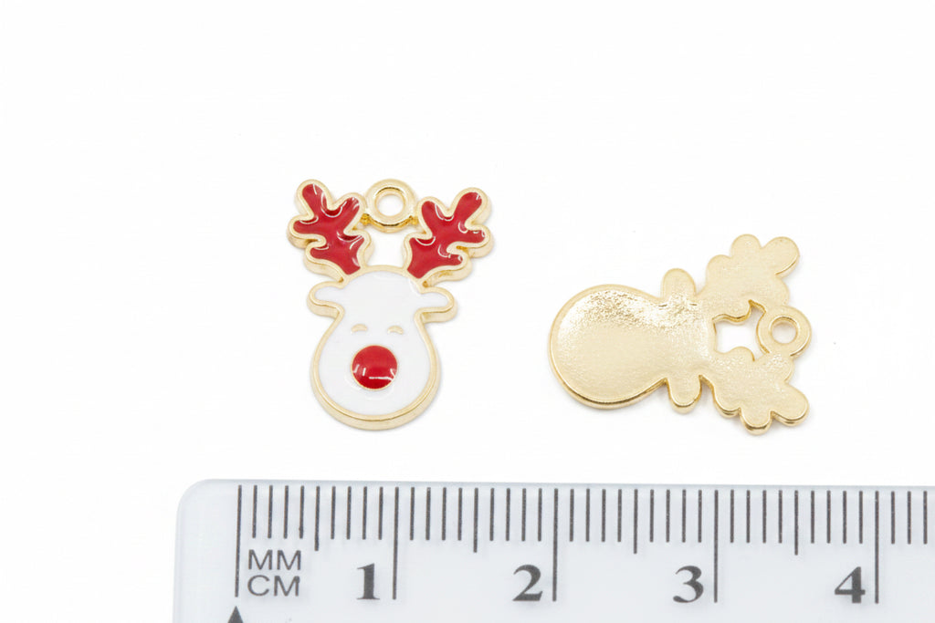 two white reindeer with red antlers and noses next to a cm ruler for scale on a white background 
